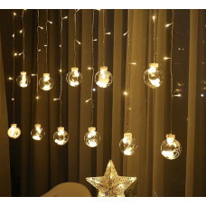 Підсвітіть своє вікно новорічною гірляндою з круглими кулями — створіть святкову атмосферу!